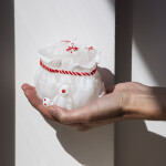 Stimmungsvolle Geschenk-Kerze als festliches Highlight